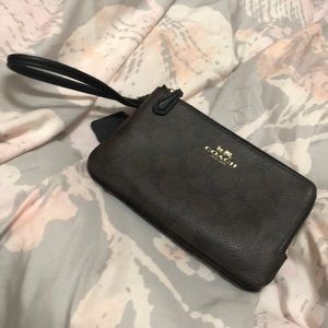 Dark brown & black Coach double zip wristlet.